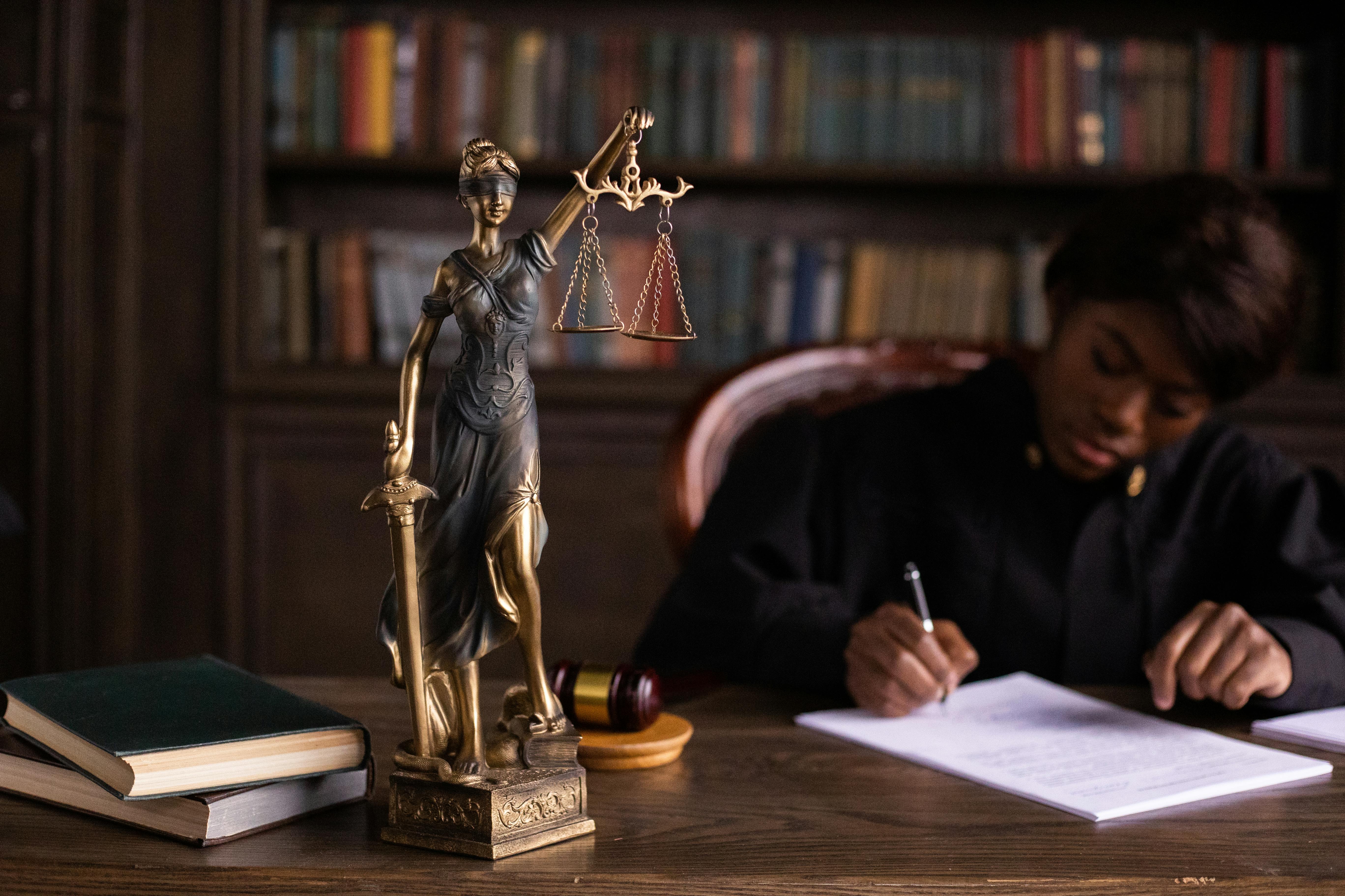 Lawyer signing document on desk
